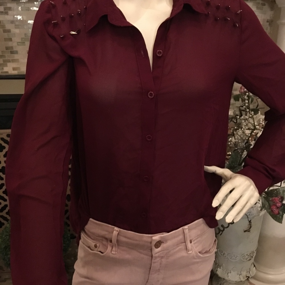 Blouse with metal spikes and open back!